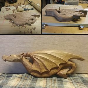 Wood carving of a dragon by Mark Arnold