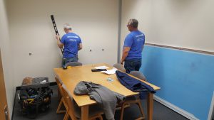 photo of a whiteboard being installed