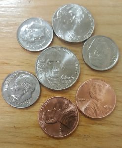 Photo of coins on a wooden table