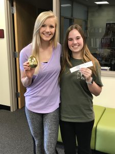 Two students with golden egg