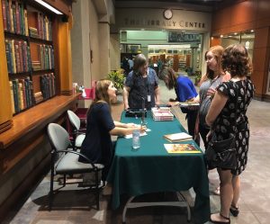 Novelist Laura McHugh signs copies of her new book, The Wolf Wants In