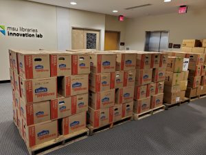 photo of boxes of books loaded on pallets