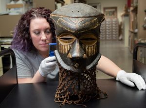 MSU student studies a mask