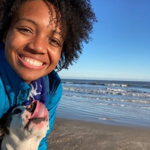 Rachel Kersey with her dog at the beach