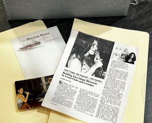 The photograph of selected items from the Research Collection includes stationary from the Nelson Hotel in Lebanon, Missouri; a photograph of Beth Spindler singing at Kentwood Arms, home of the Fox and Hounds Lounge; and an article about Mrs. Spindler.