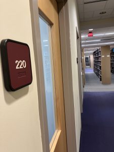 Picture of the outside of a study room at the Duane G. Meyer Library. Red sign with the number 220 outside of it. These rooms will be renovated and will be accessible for people with disabilities.