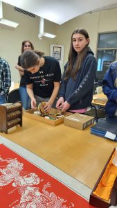 A troop of American Heritage Girls looks at materials in Special Collections & Archives at Missouri State University's Duane G. Meyer Library