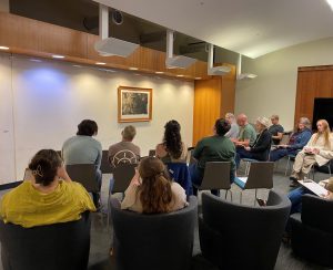Attendees looking at exhibit of art in Meyer Library