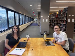 two students sit and study