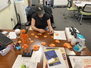 Gabi Martin counts ballots at her desk