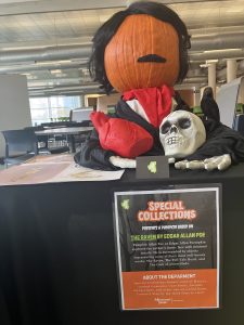 pumpkin designed to look like Edgar Allan Poe. I that a wig on and a mustache. There is no face drawn on the pumpkin.