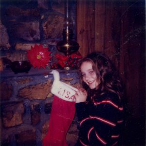 Young girl checks her Christmas stocking