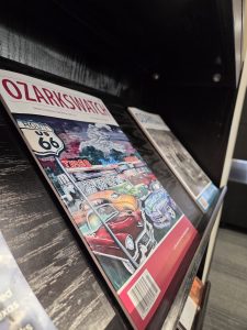 magazine with graffiti themed around Route 66 sits on a stand